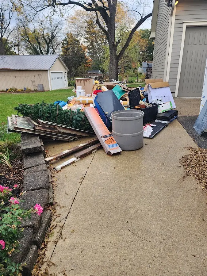 Dumpster being loaded with debris for 12 Yard Dumpster Rental in Selbyville